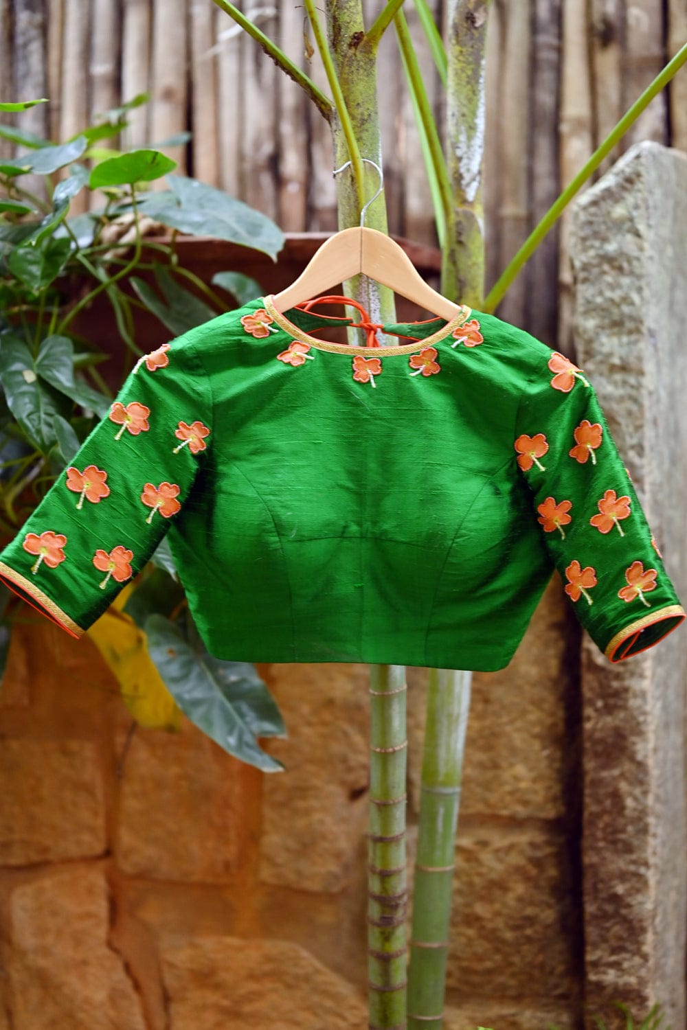 Green raw silk close neck blouse with hand painted and embroidered kanakambaram