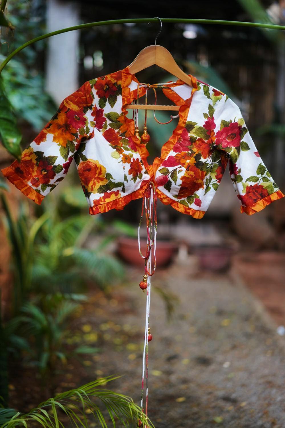 Off white and orange floral handspun & pure muslin v neck blouse with frill detailing - House of Blouse