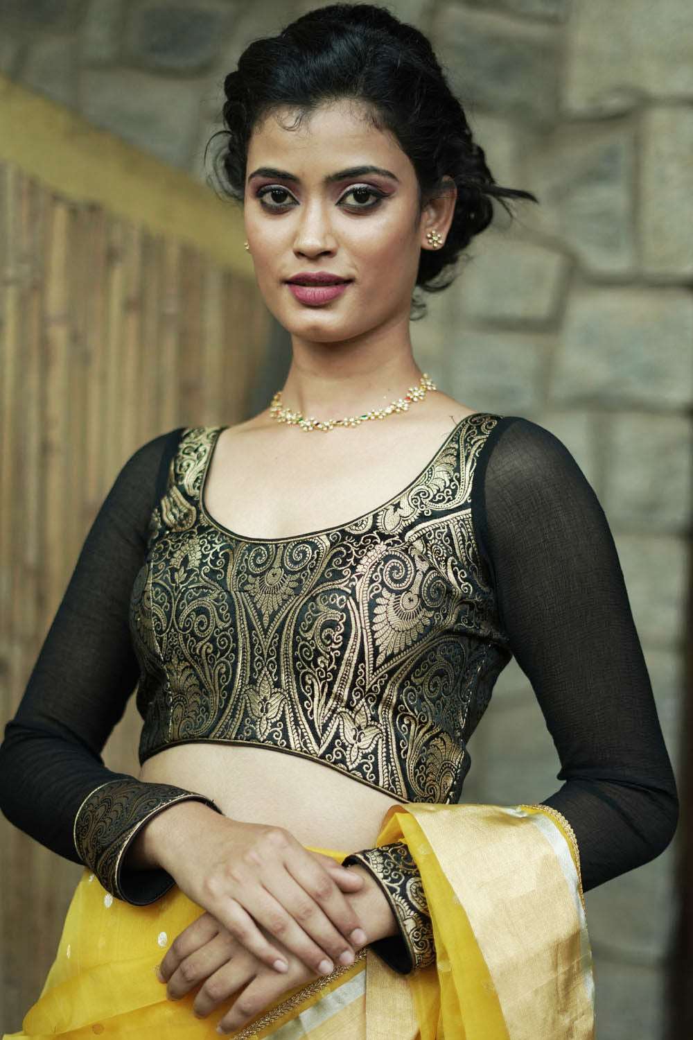 Black pure banarasi brocade U neck blouse with chiffon sleeves and cuff detailing