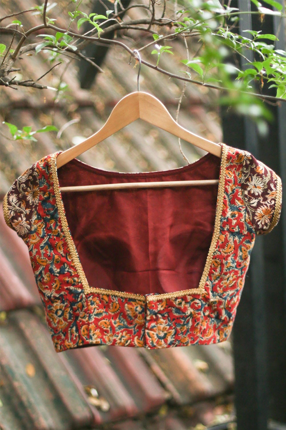 Maroon and Brown cotton kalamkari close neck blouse with gold border