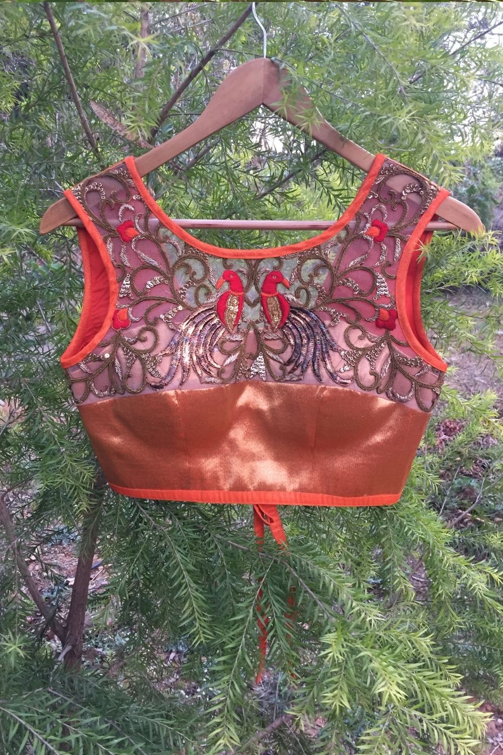 Orange tissue sleeveless blouse with embellished yoke and tie back - House of Blouse