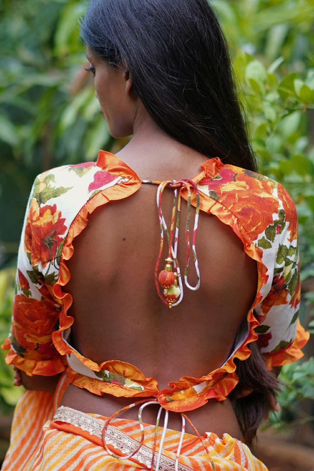 Off white and orange floral handspun & pure muslin v neck blouse with frill detailing - House of Blouse