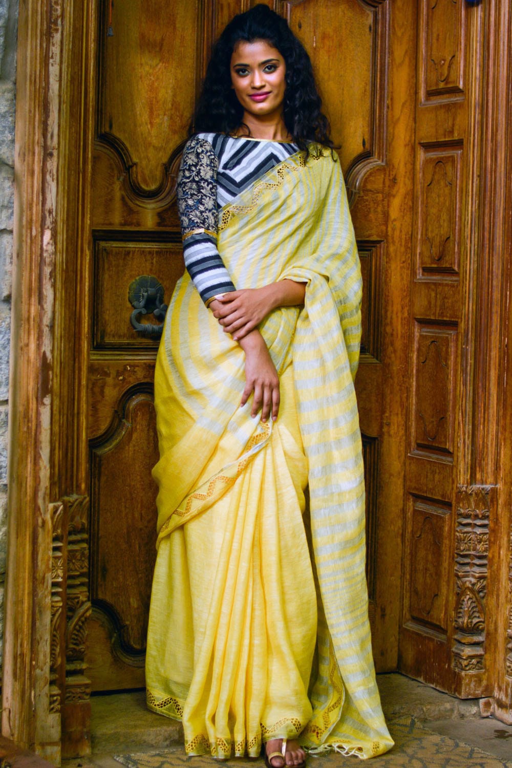 Lemon yellow handwoven linen silver stripes saree with cutwork border and cutwork pallu