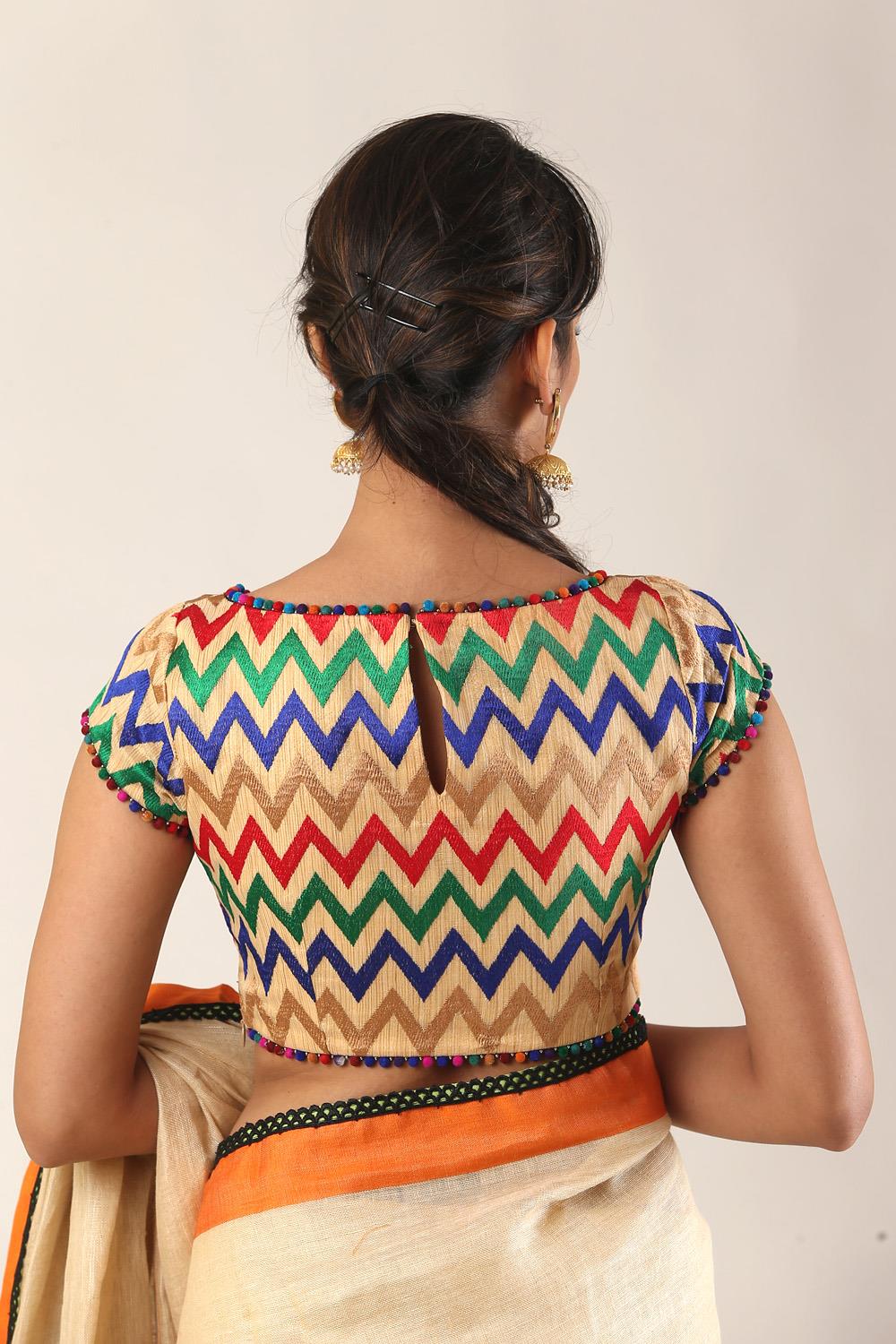 Beige and multicolour chevron threadwork boatneck blouse with pom pom edging