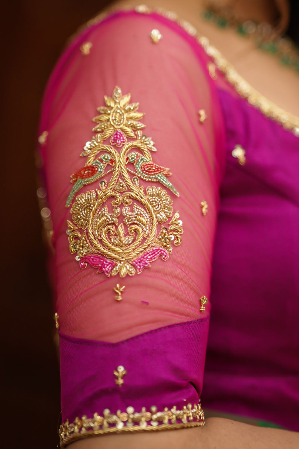 Magenta pure sIlk sweetheart neck blouse with zardosi work on net.