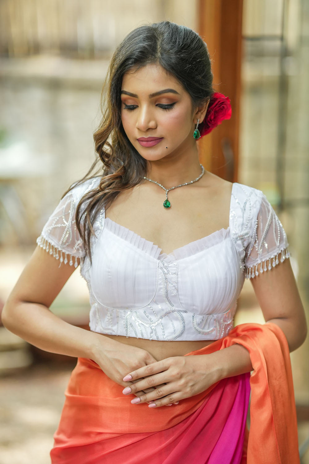 White sequin sweetheart neck blouse with  net frills detailing.