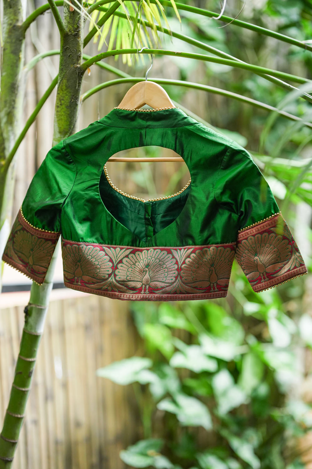 Emerald green silk pot neck blouse with peacock brocade border