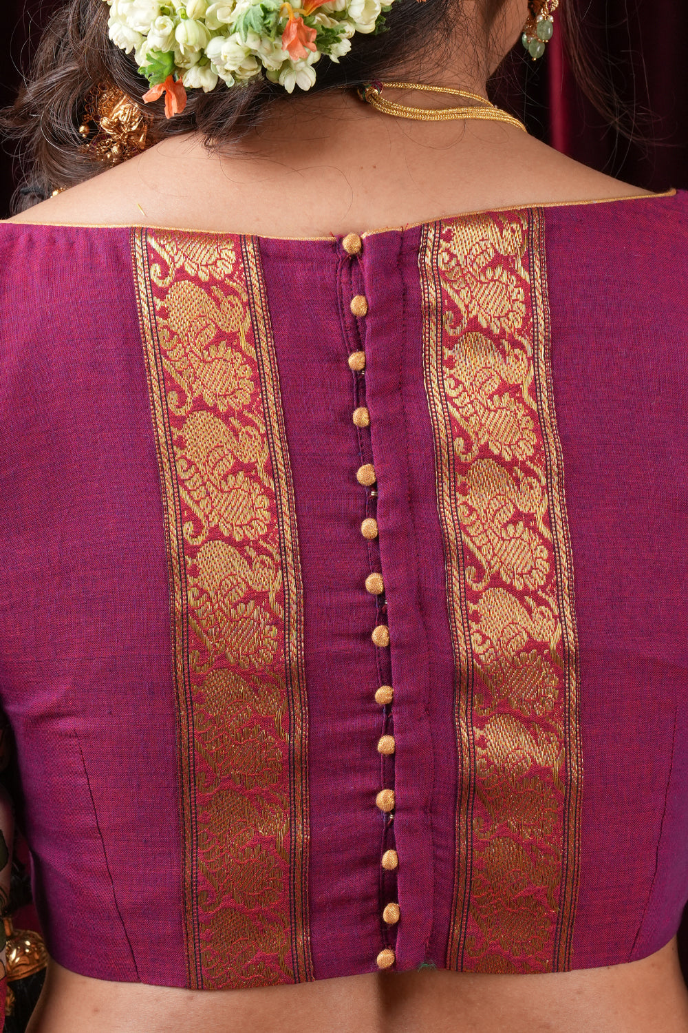 Plum narayanpet cotton boatneck blouse with 3/4th kalamkari sleeves and zari patch.