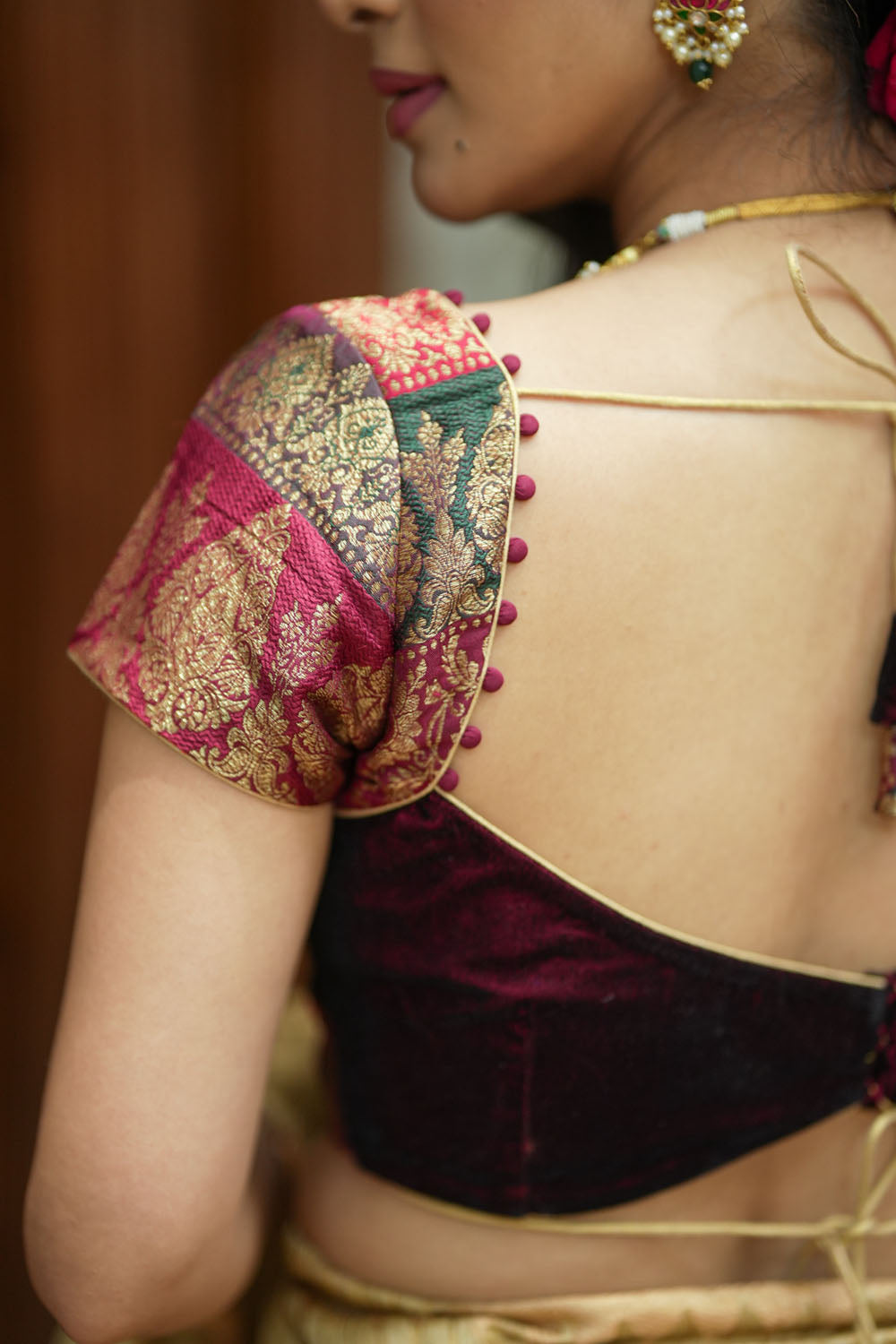 Burgundy velvet and banarasi brocade sweetheart neck blouse with potli button detailing