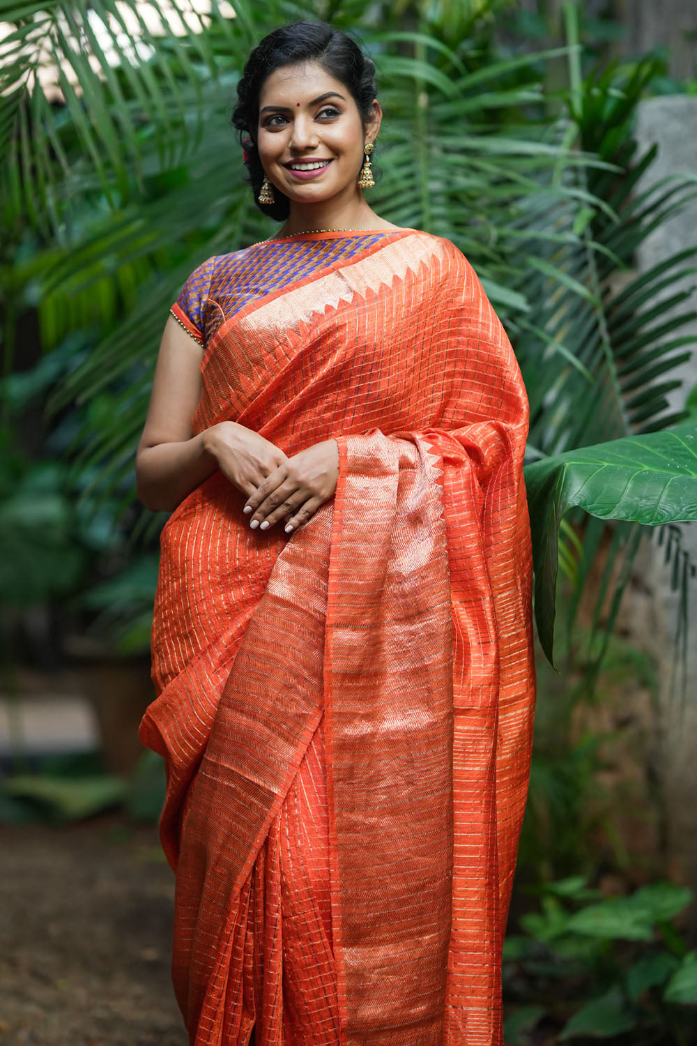 Orange matka silk with zari checks and wide zari temple border Saree
