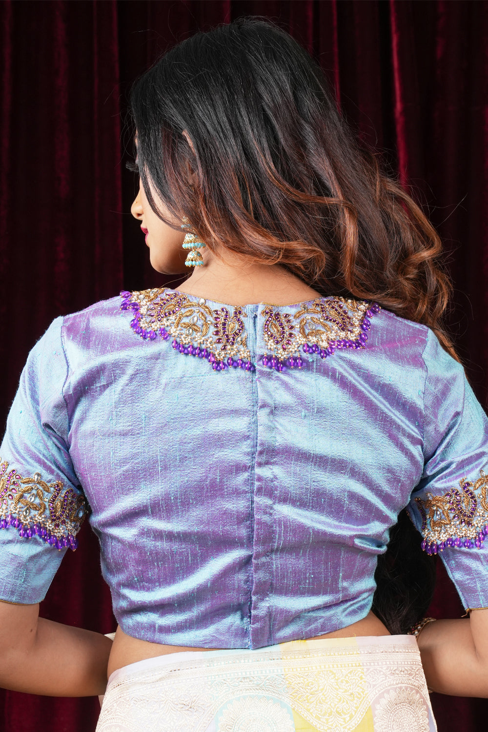 Periwinkle pure raw silk close neck blouse with intricate hand embroidery on sleeves and neck.