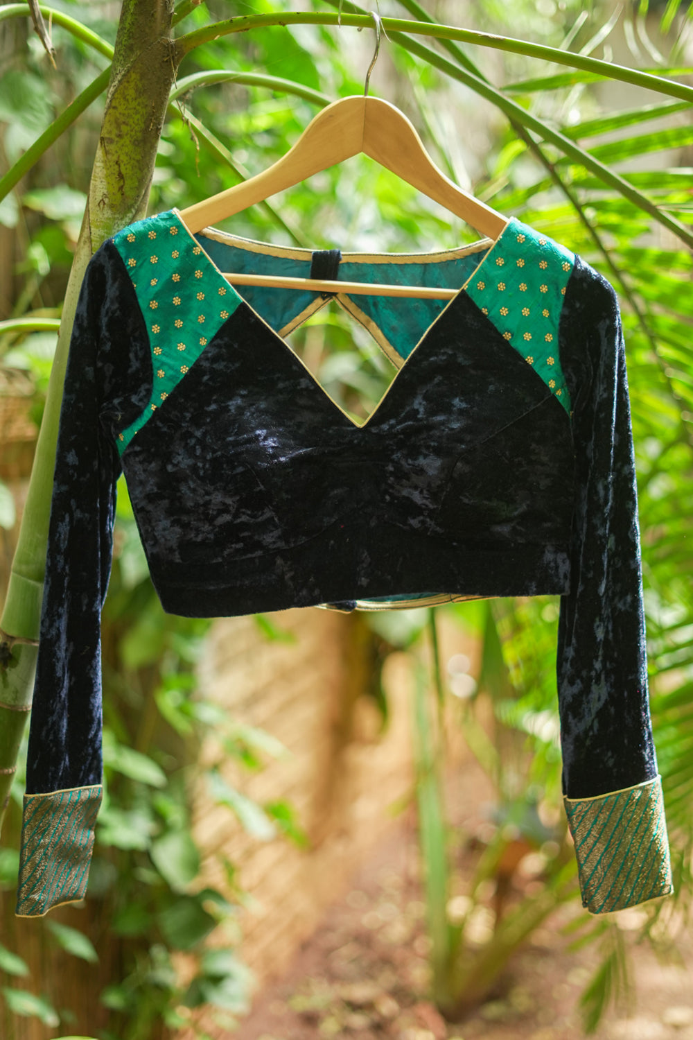 Navy blue crushed velvet V neck blouse with raw silk and brocade detailing