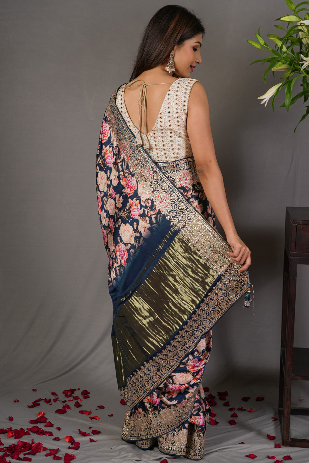 Navy blue gajji silk saree with floral print and crushed zari border