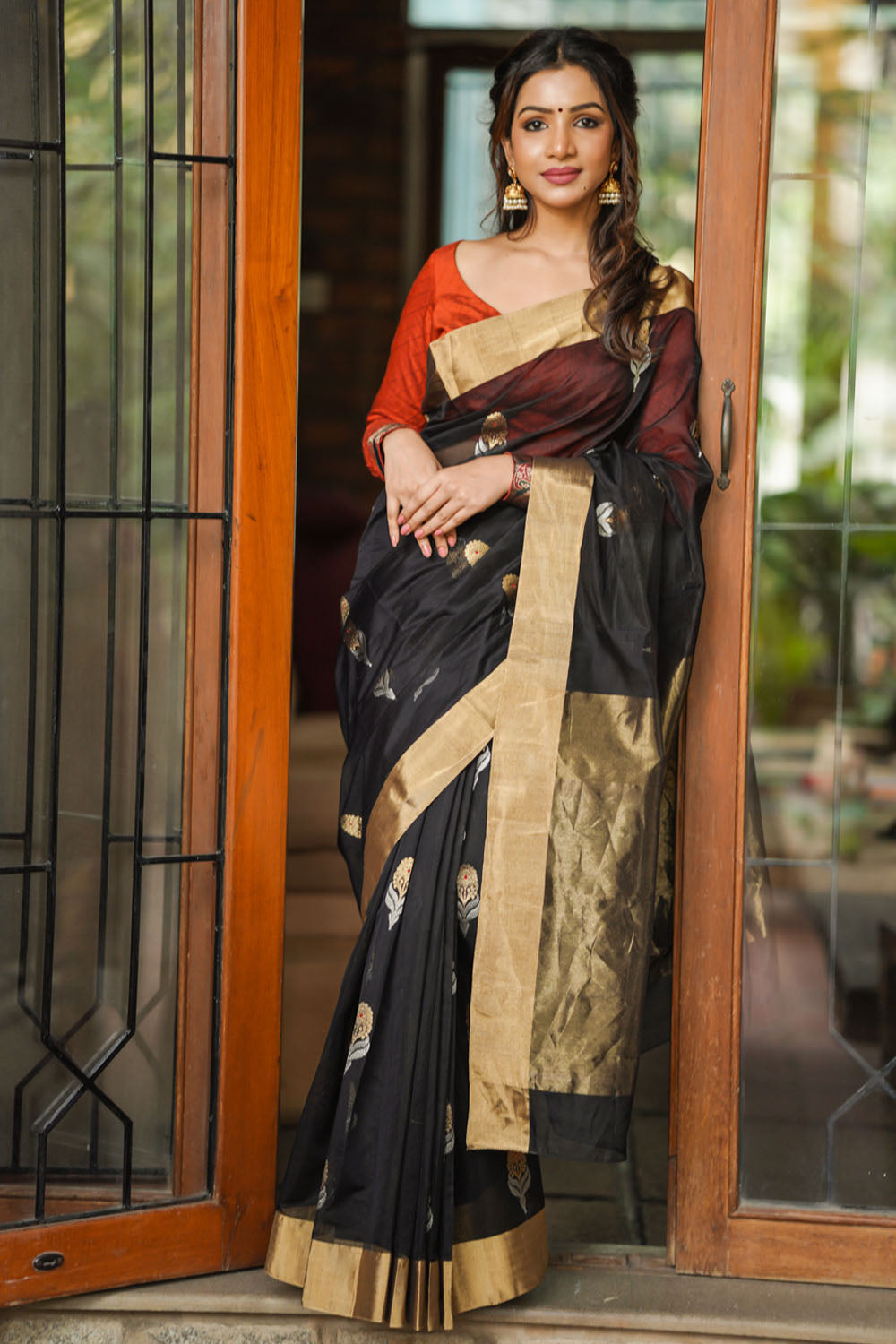 Black chanderi silk saree with floral motifs in silver and gold