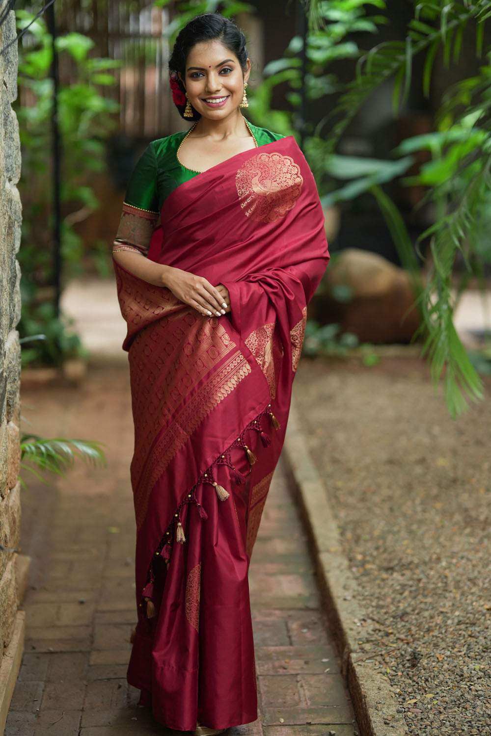 Deep red Kanjivaram saree with dacing peacock motifs