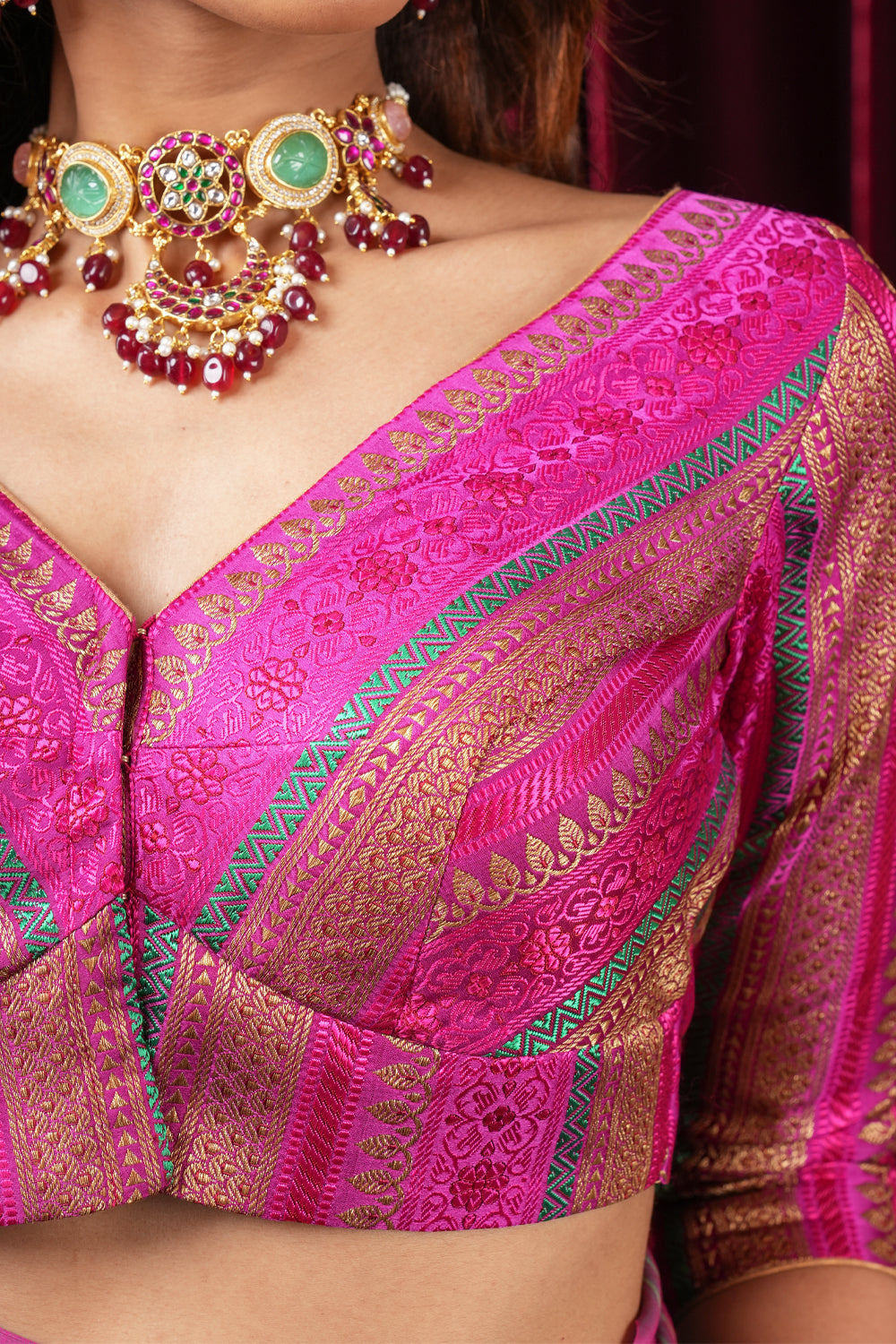 Rani pink multicolor striped brocade banarasi  V neck blouse with 3/4th sleeves.