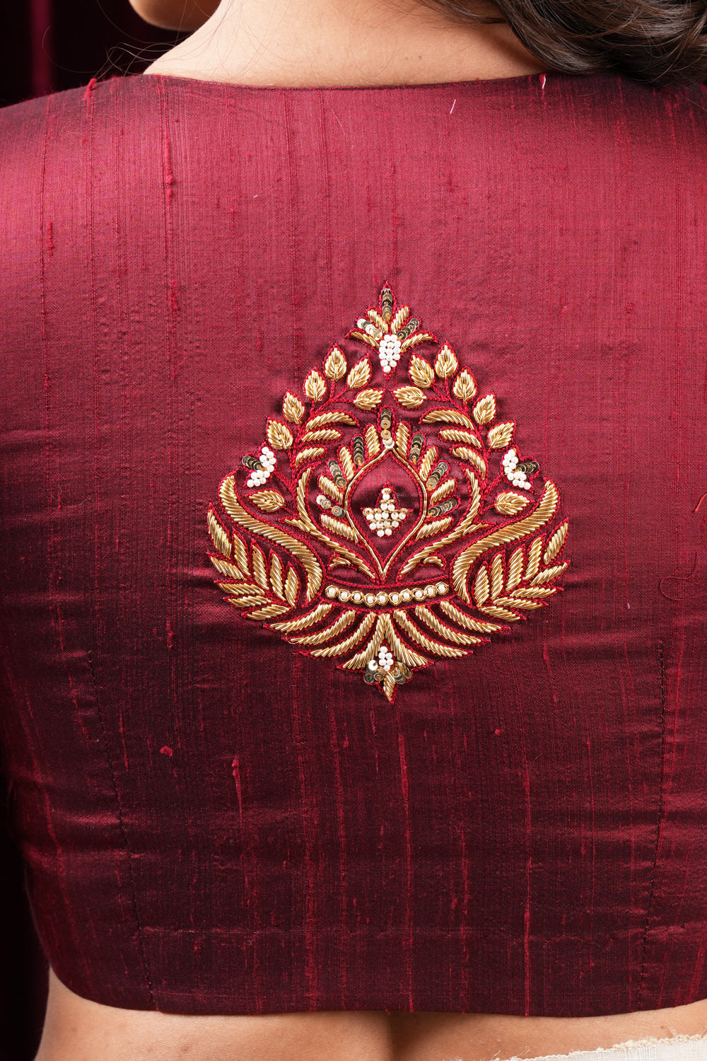 Maroon pure raw silk close neck, puff sleeves  blouse with zardosi work.