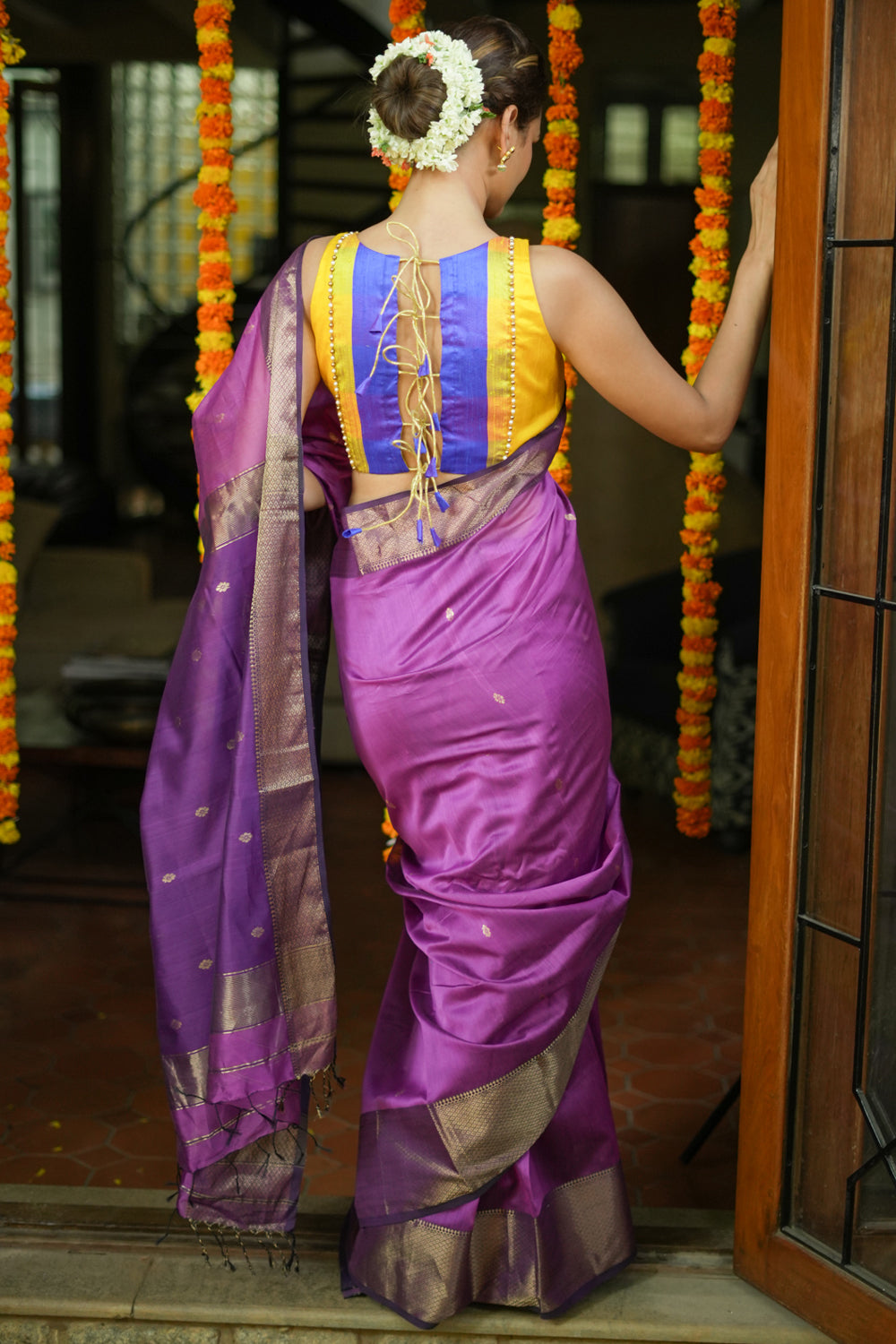 Purple maheshwari silk cotton saree with  muted gold border