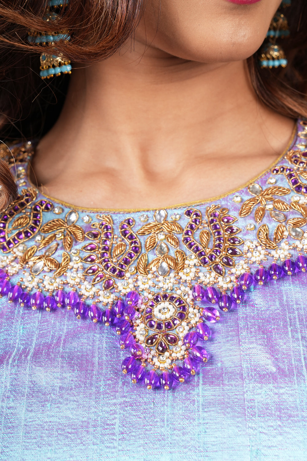 Periwinkle pure raw silk close neck blouse with intricate hand embroidery on sleeves and neck.