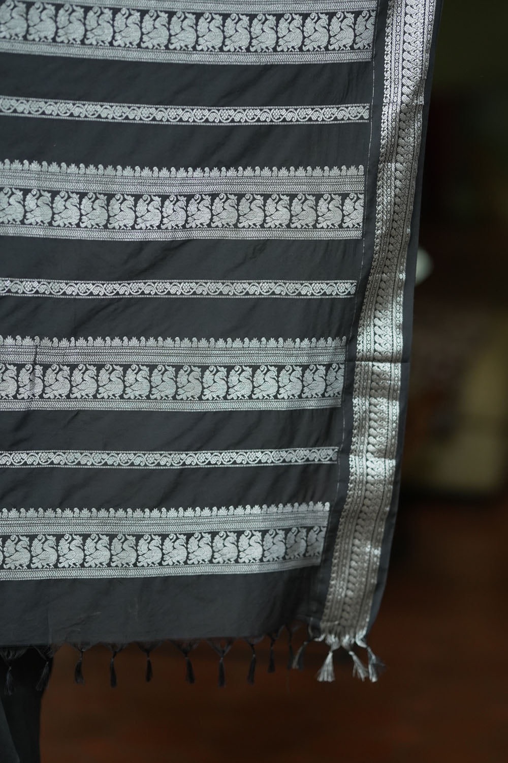 Black cotton silk with silver zari borders and buttas saree