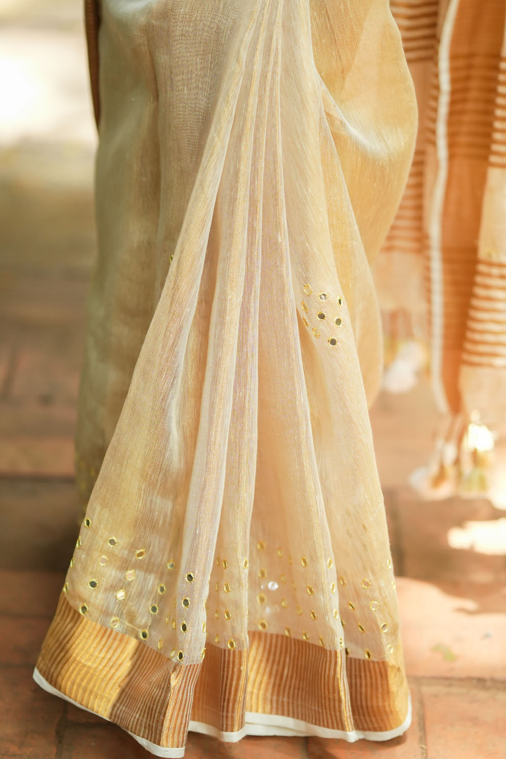 Tan Gold Tissue Linen Saree with light mirror work