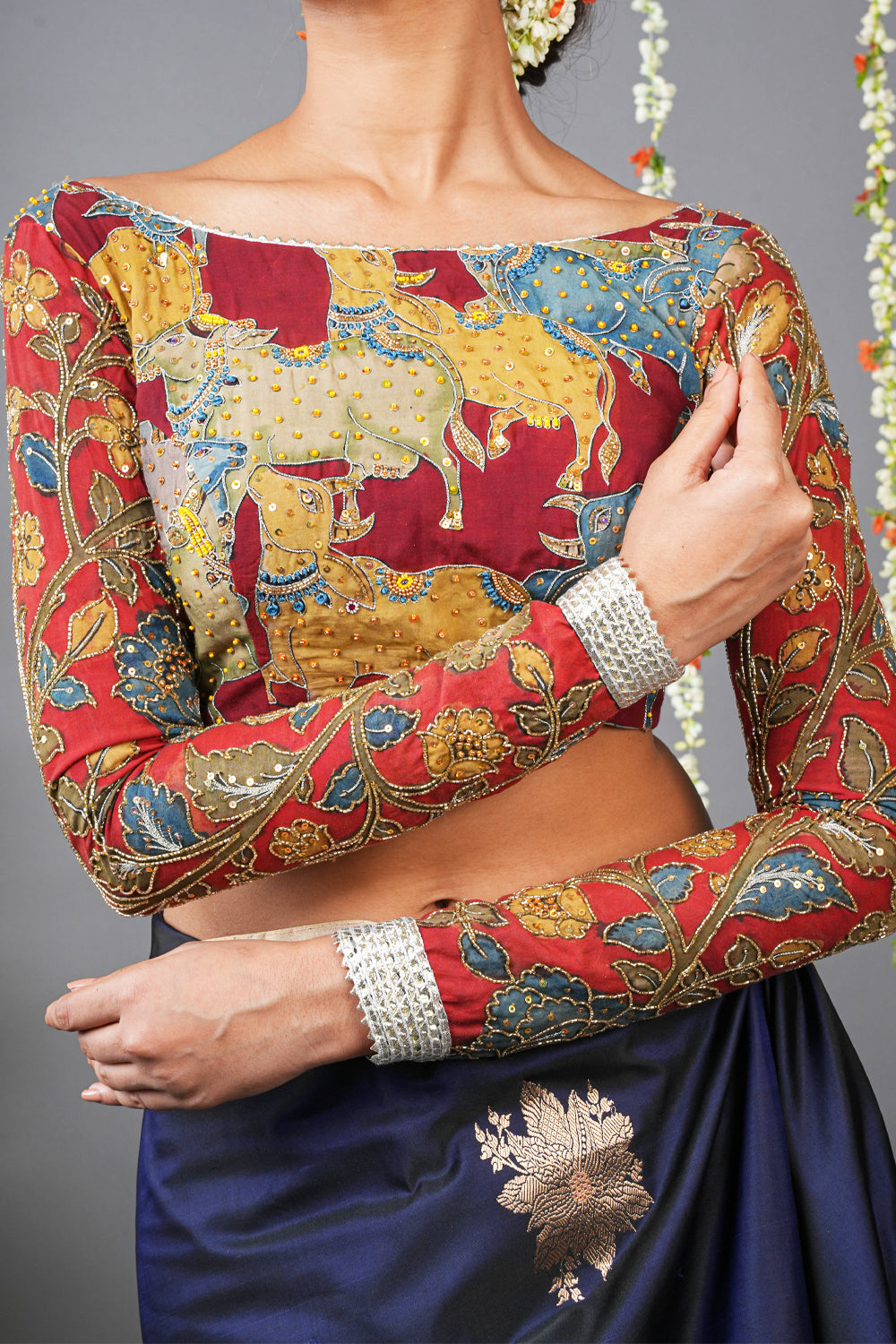 Maroon boatneck kalamkari  full sleeve blouse with handmade stonework.