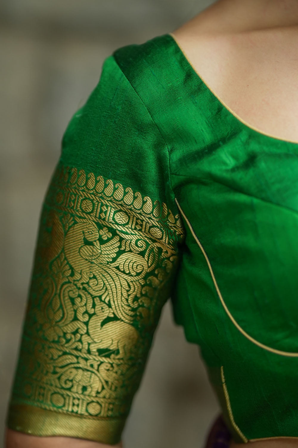 Green pure raw silk sweetheart neck blouse with broad zari border sleeves