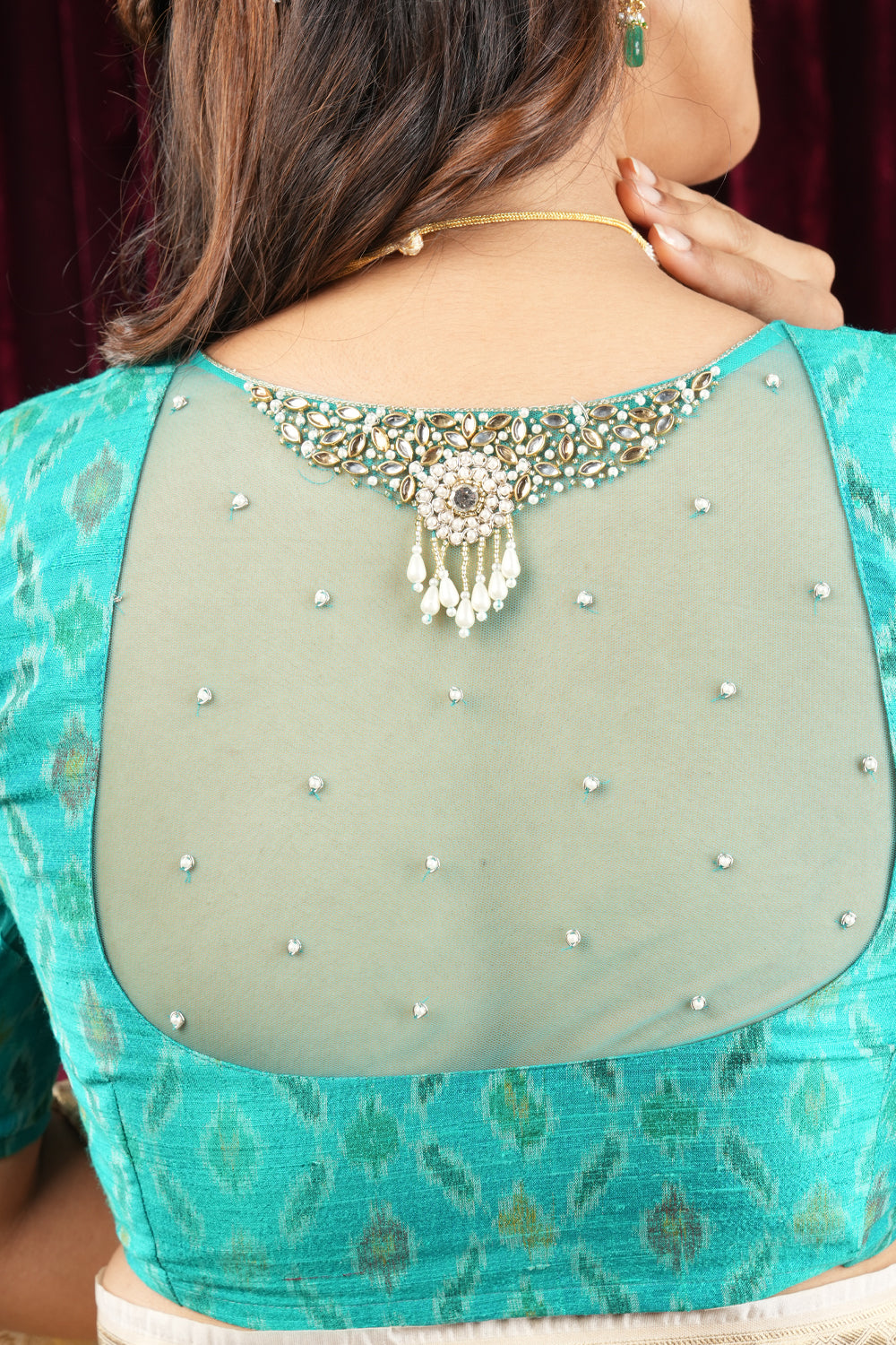 Cyan Pure ikkat Raw silk blouse with Rhinestone detailing in back and sleeves