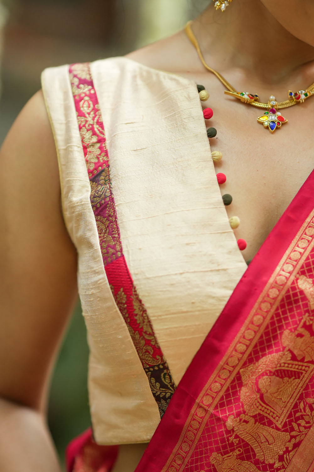 Ivory pure raw silk V neck sleeveless blouse with banarasi trim and potli button detailing