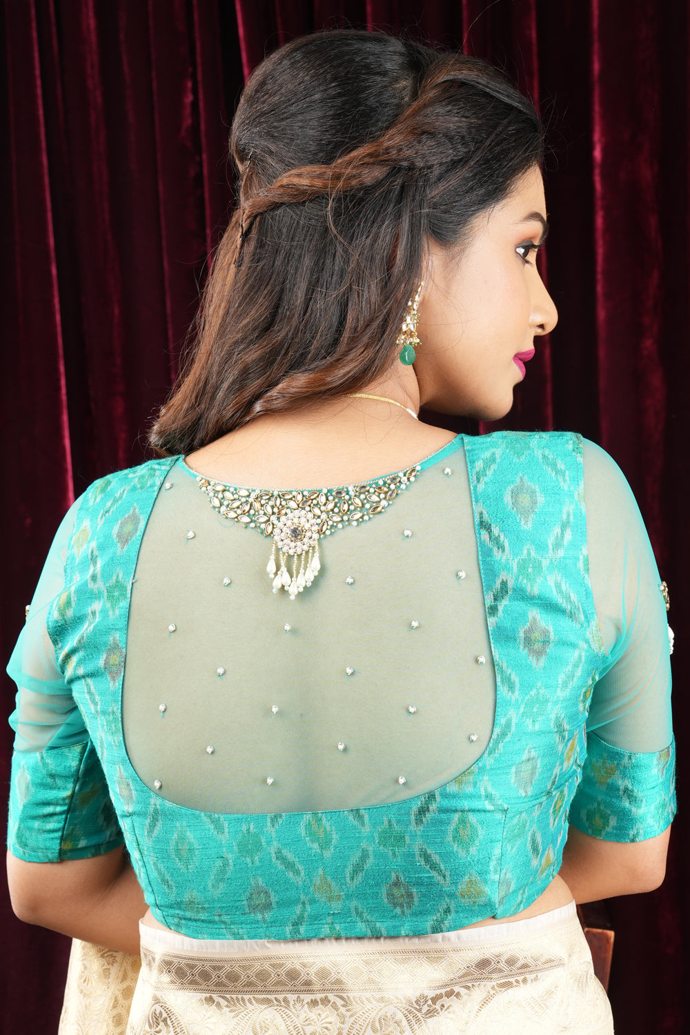 Cyan Pure ikkat Raw silk blouse with Rhinestone detailing in back and sleeves