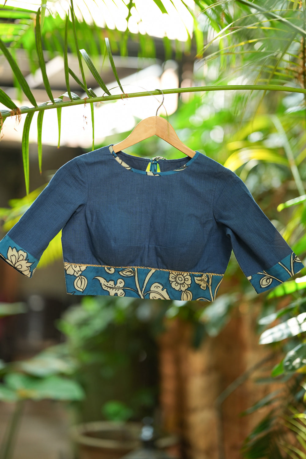 Saphire blue closed neck handloom blouse with handpainted kalamkari border.