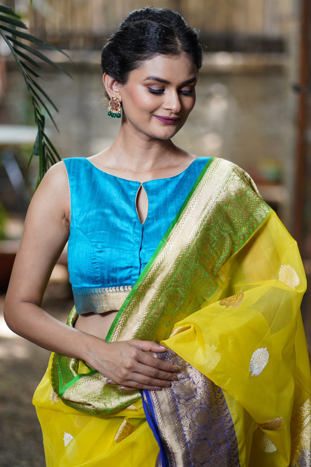 Copper Sulphate Blue Pure Raw Silk Sleeveless blouse with Wide Kanchi Border detailing in back