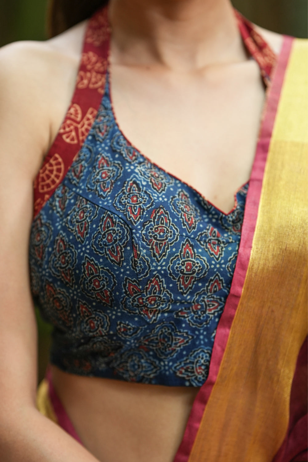 Indigo ajrakh print halter neck blouse with maroon hand block print border