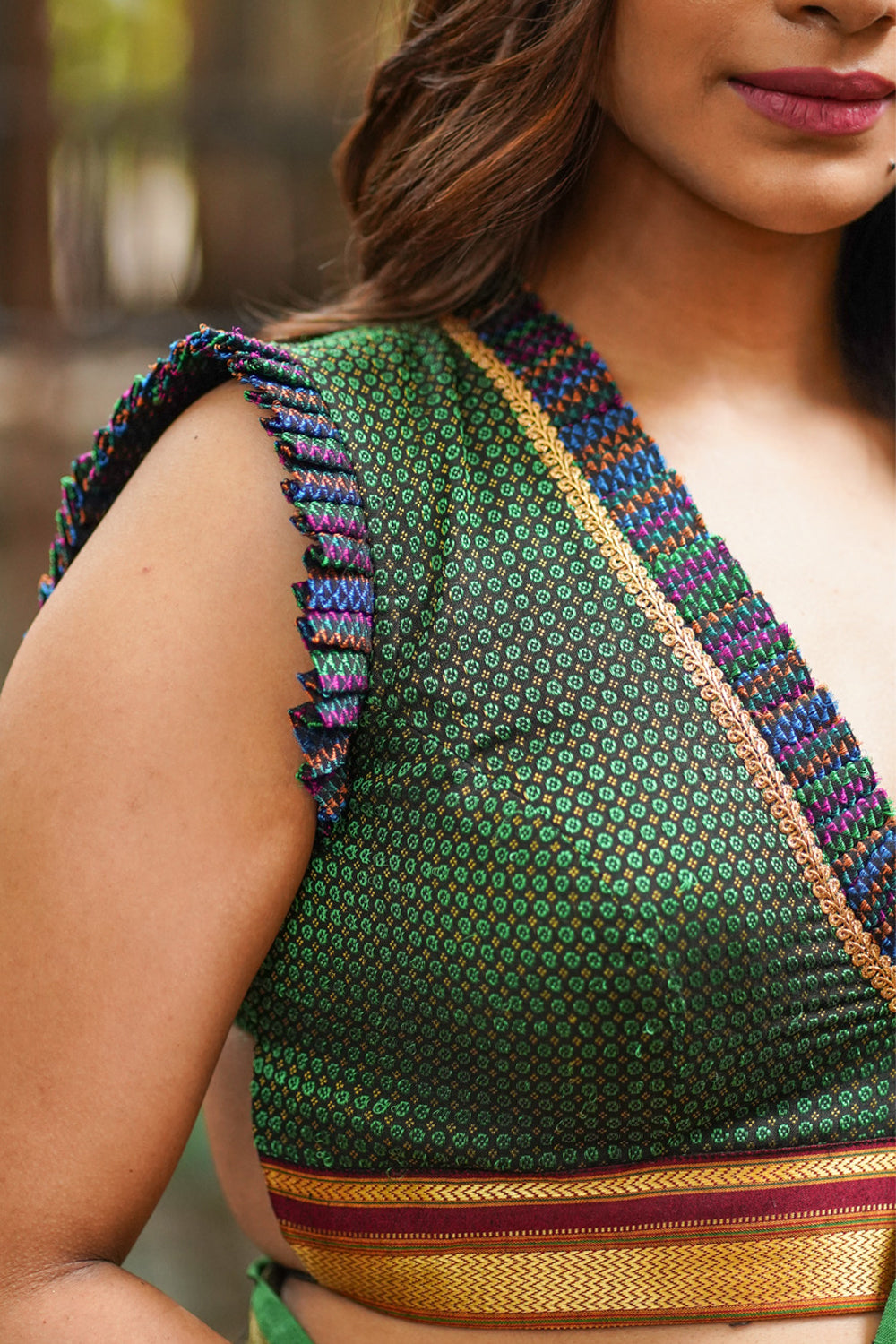 Dark green & black khana silk V neck blouse with frill detailing and backless design