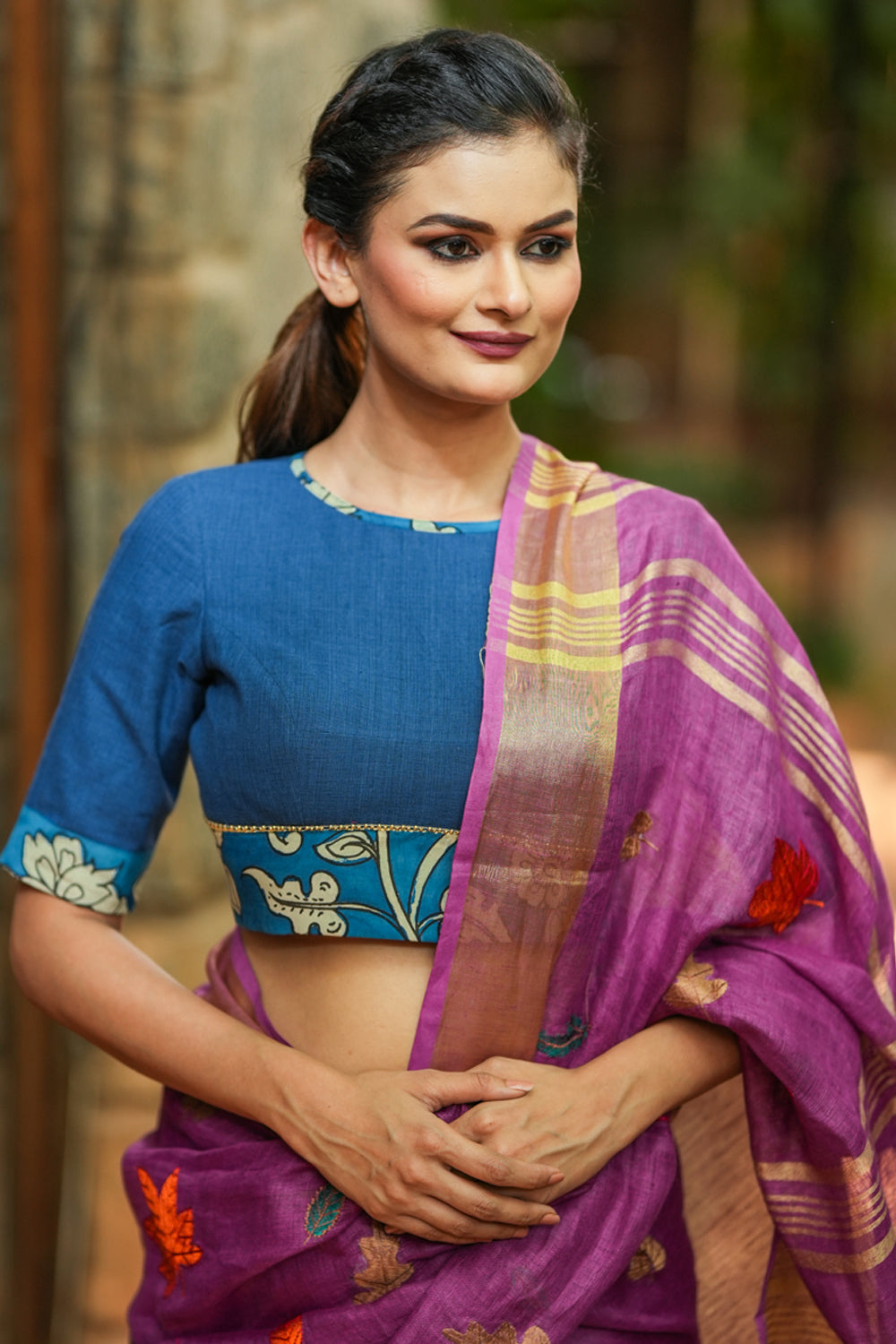 Saphire blue closed neck handloom blouse with handpainted kalamkari border.