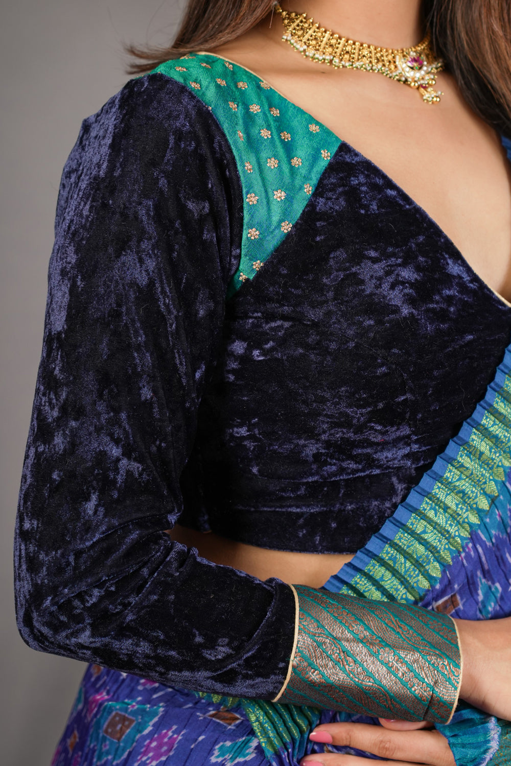 Navy blue crushed velvet V neck blouse with raw silk and brocade detailing