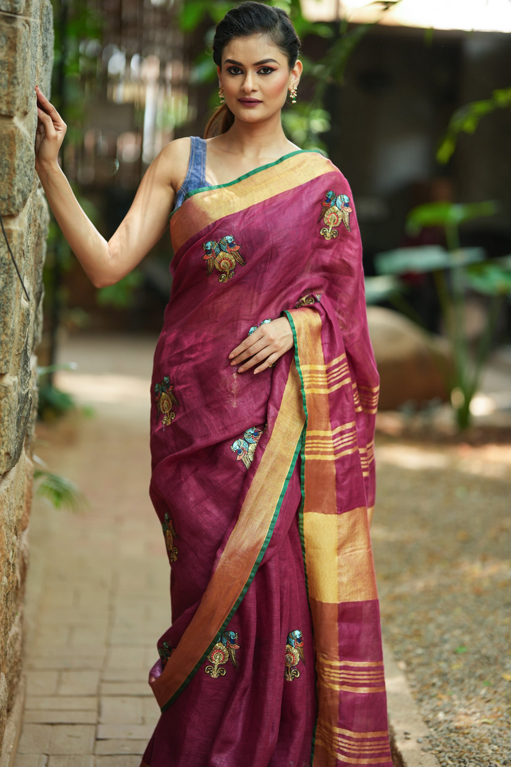 Dark purple linen saree with embroidered parrots motifs