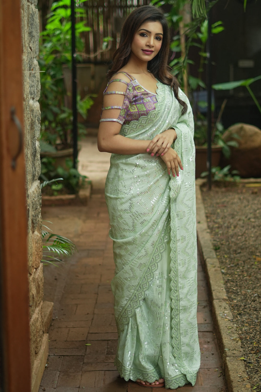 Pista green georgette sequin saree with scalloped edging