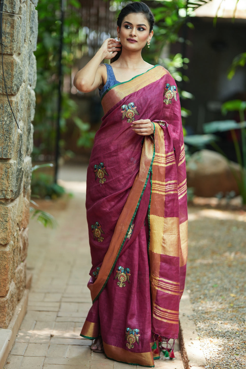 Dark purple linen saree with embroidered parrots motifs