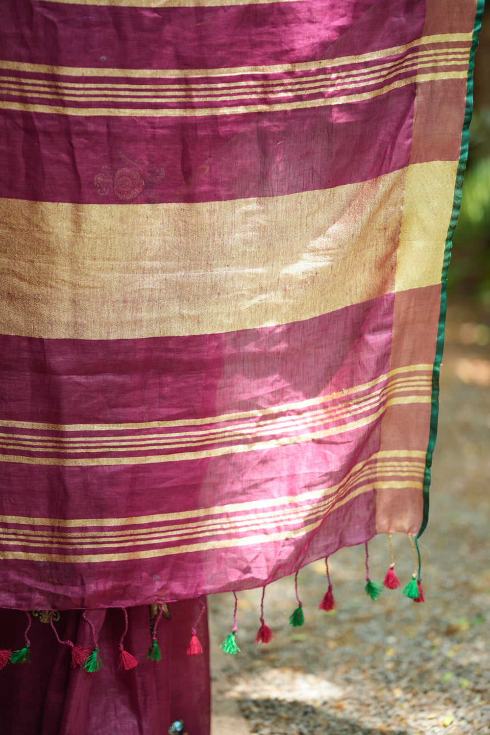 Dark purple linen saree with embroidered parrots motifs