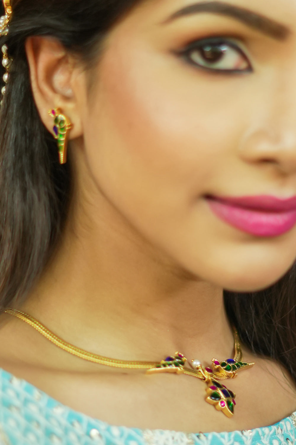Peacock and floral necklace set with multicolor stones.