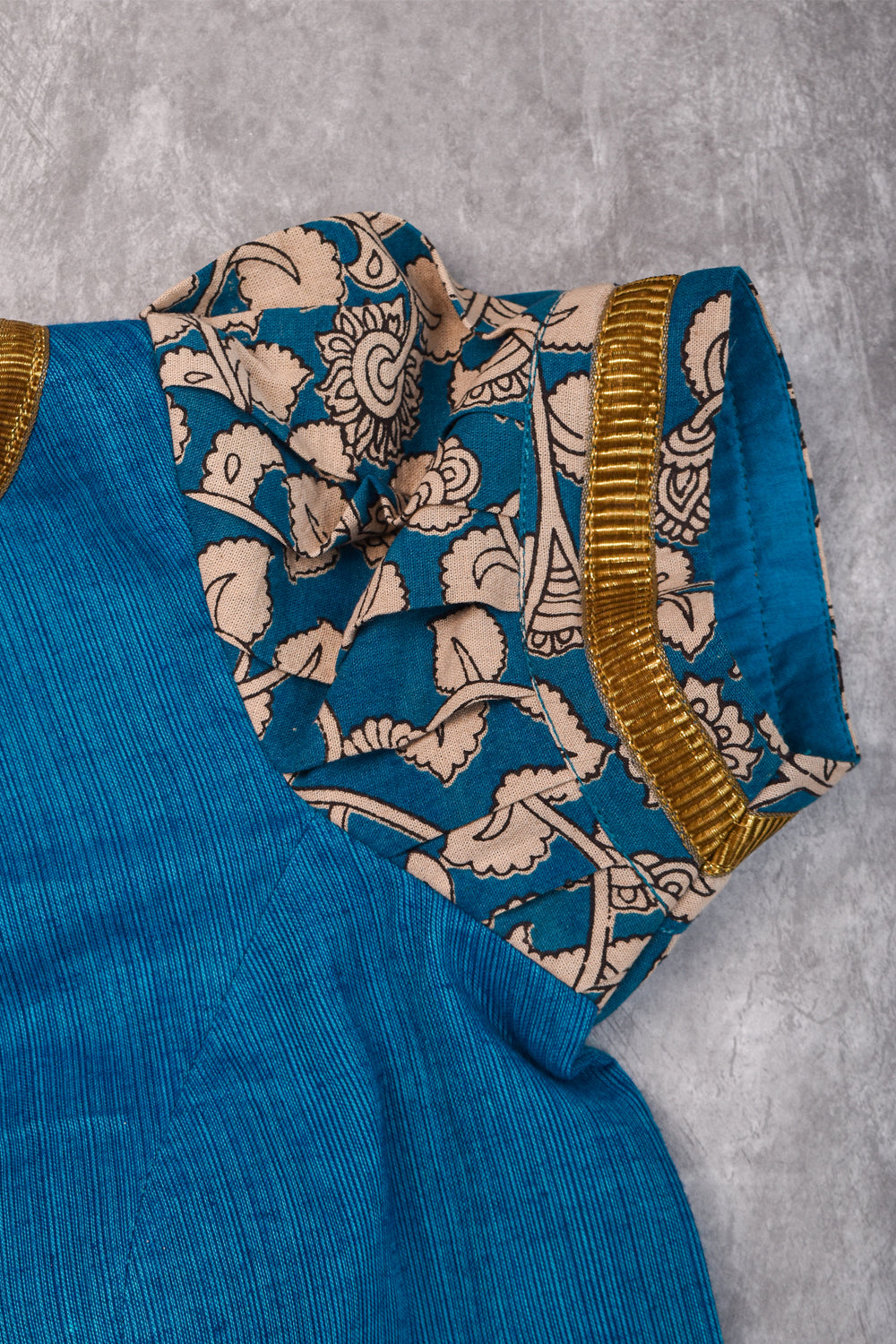 Blue handloom boatneck blouse with floral kalamkari sleeve detailing