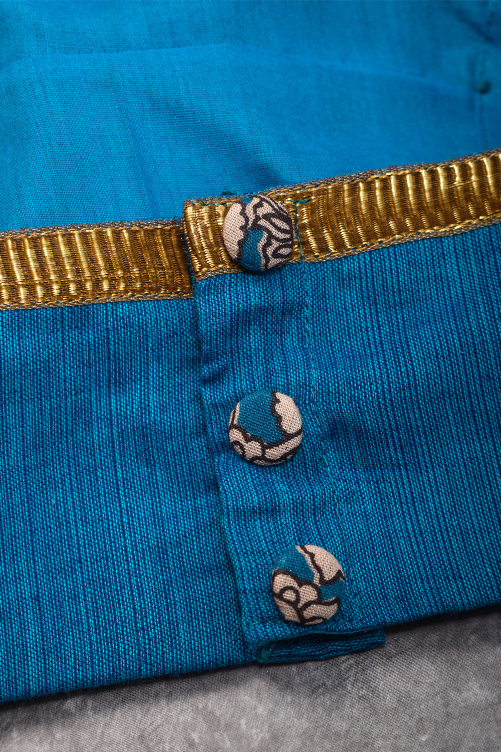 Blue handloom boatneck blouse with floral kalamkari sleeve detailing