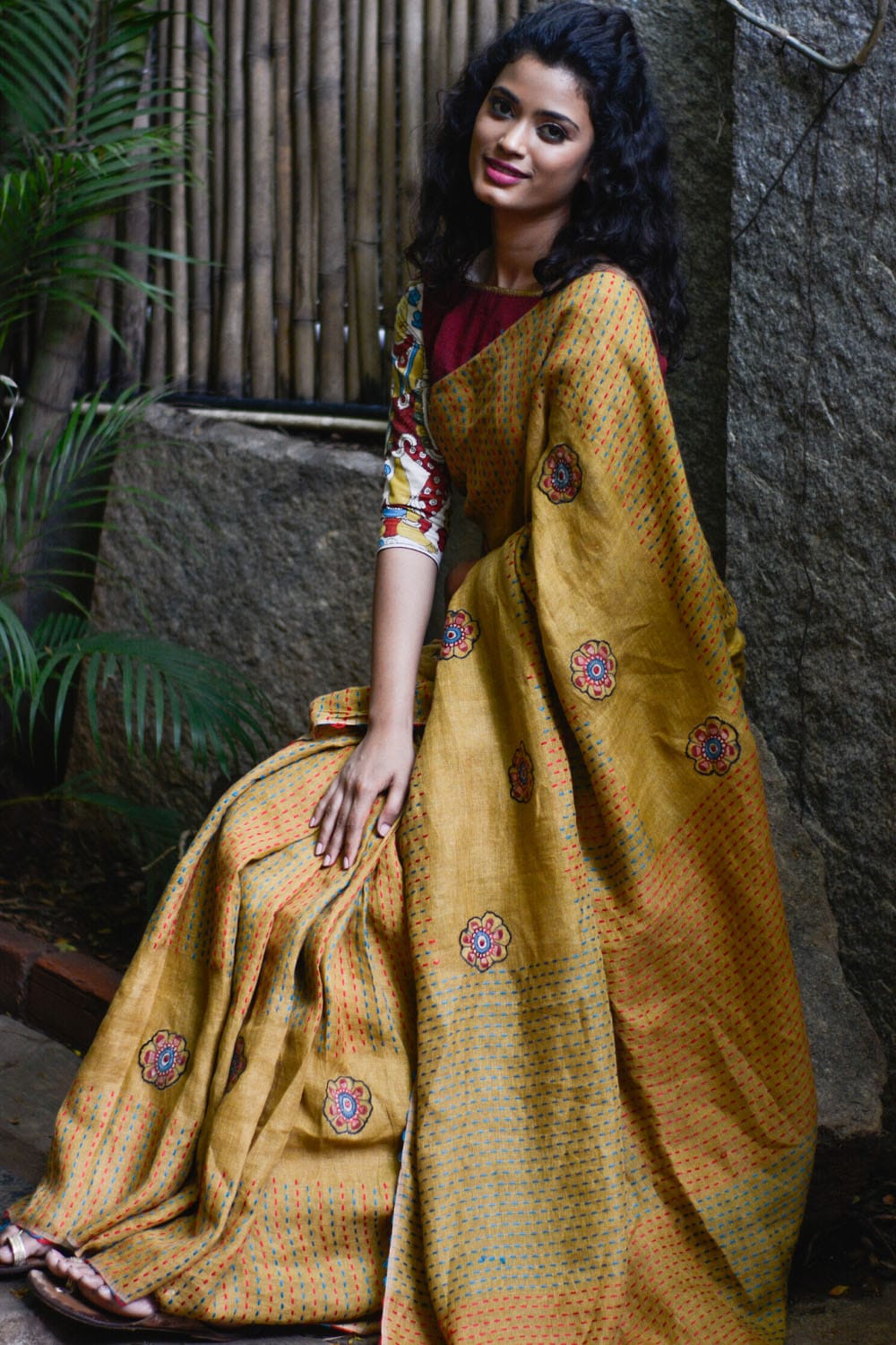 Mustard multicolour back stitch handwoven linen saree with floral kalamkari applique