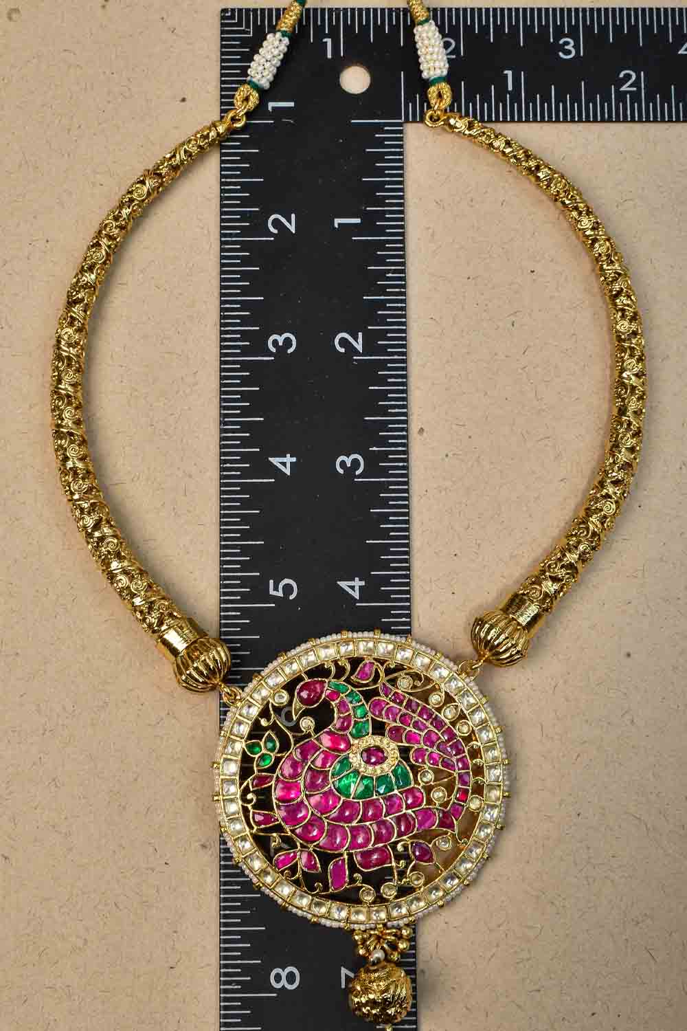 Distinct gold tone hasli with Prominent Kemp Peacock in Mandala Pendant Necklace Set
