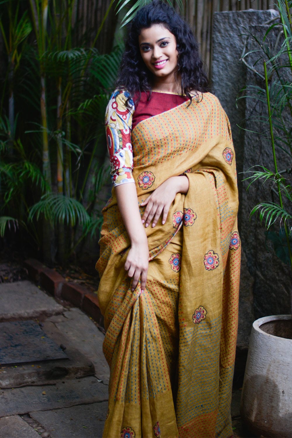 Mustard multicolour back stitch handwoven linen saree with floral kalamkari applique