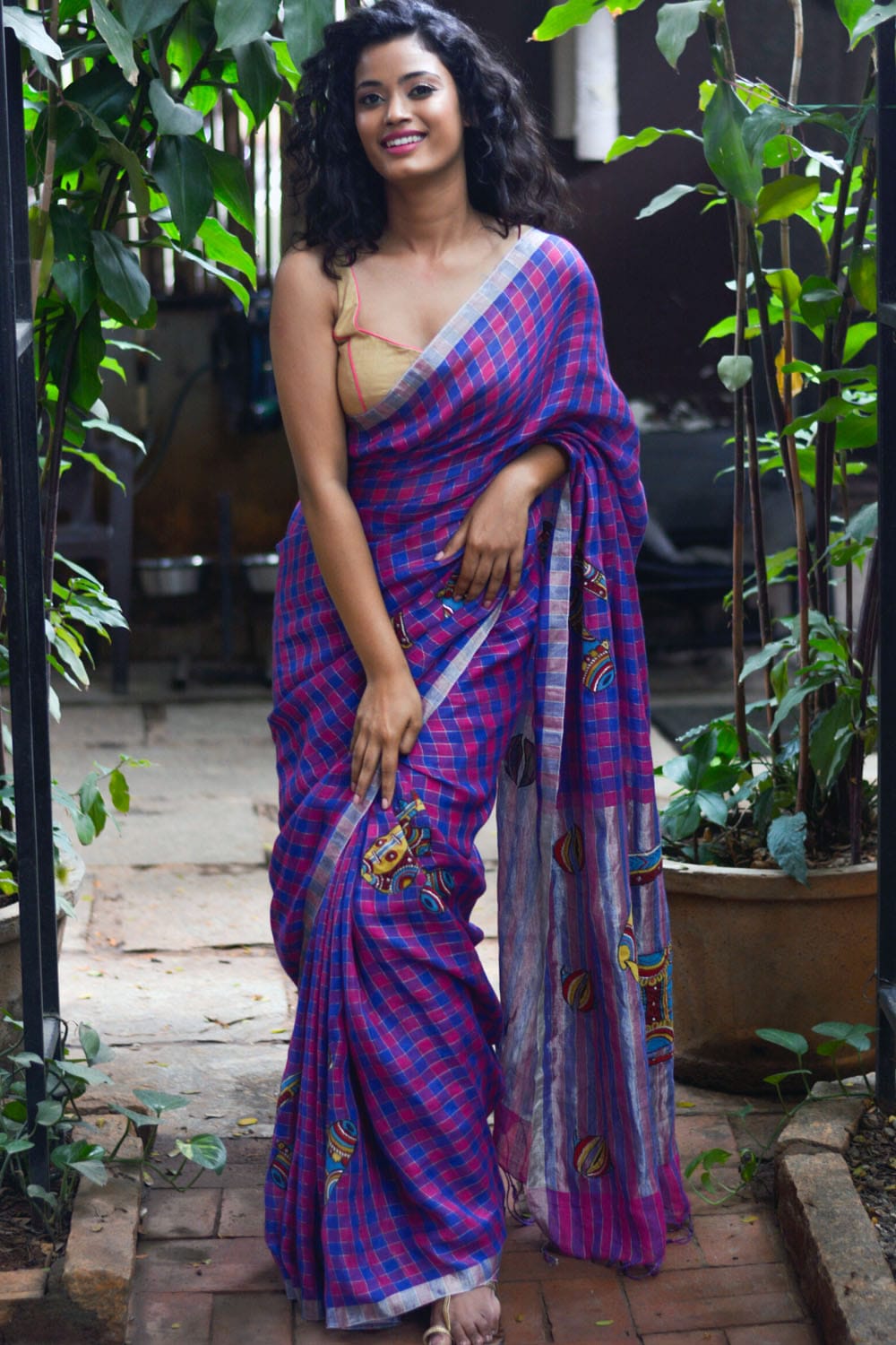 Pink blue checked handwoven linen saree with musical instruments kalamkari applique