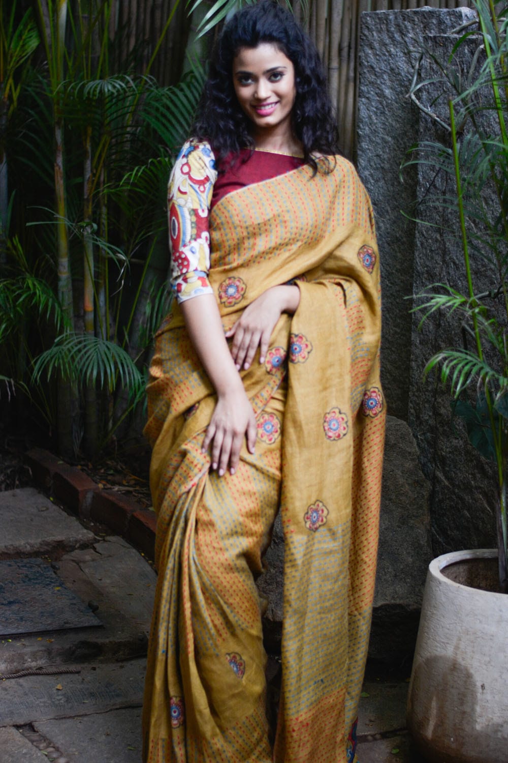 Mustard multicolour back stitch handwoven linen saree with floral kalamkari applique