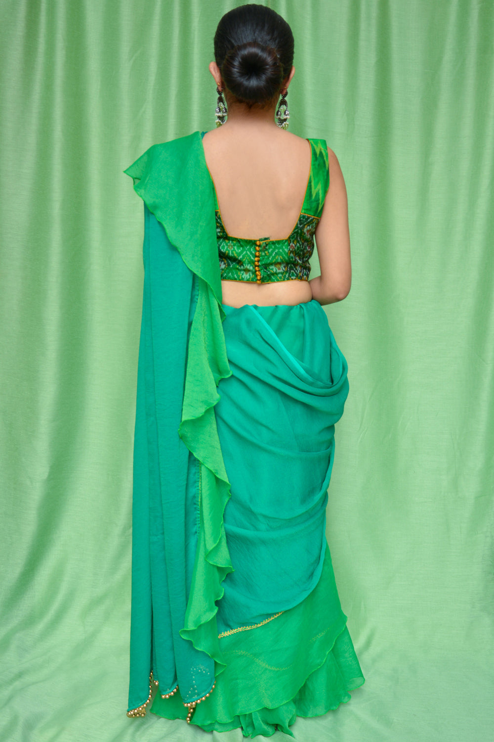 Green shimmer georgette ruffle saree with green-gold border - House of Blouse