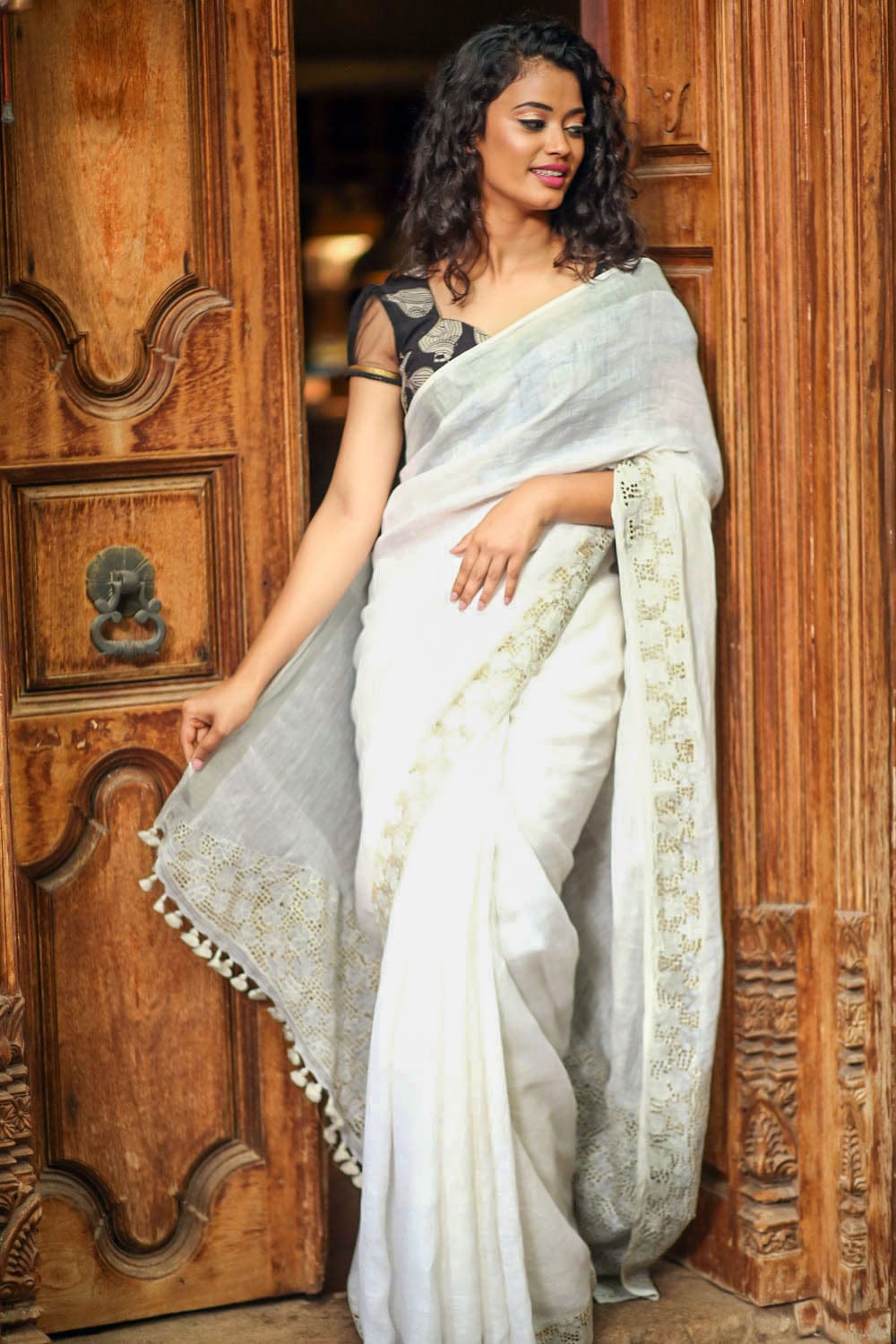 White handwoven linen saree with cutwork border and pallu